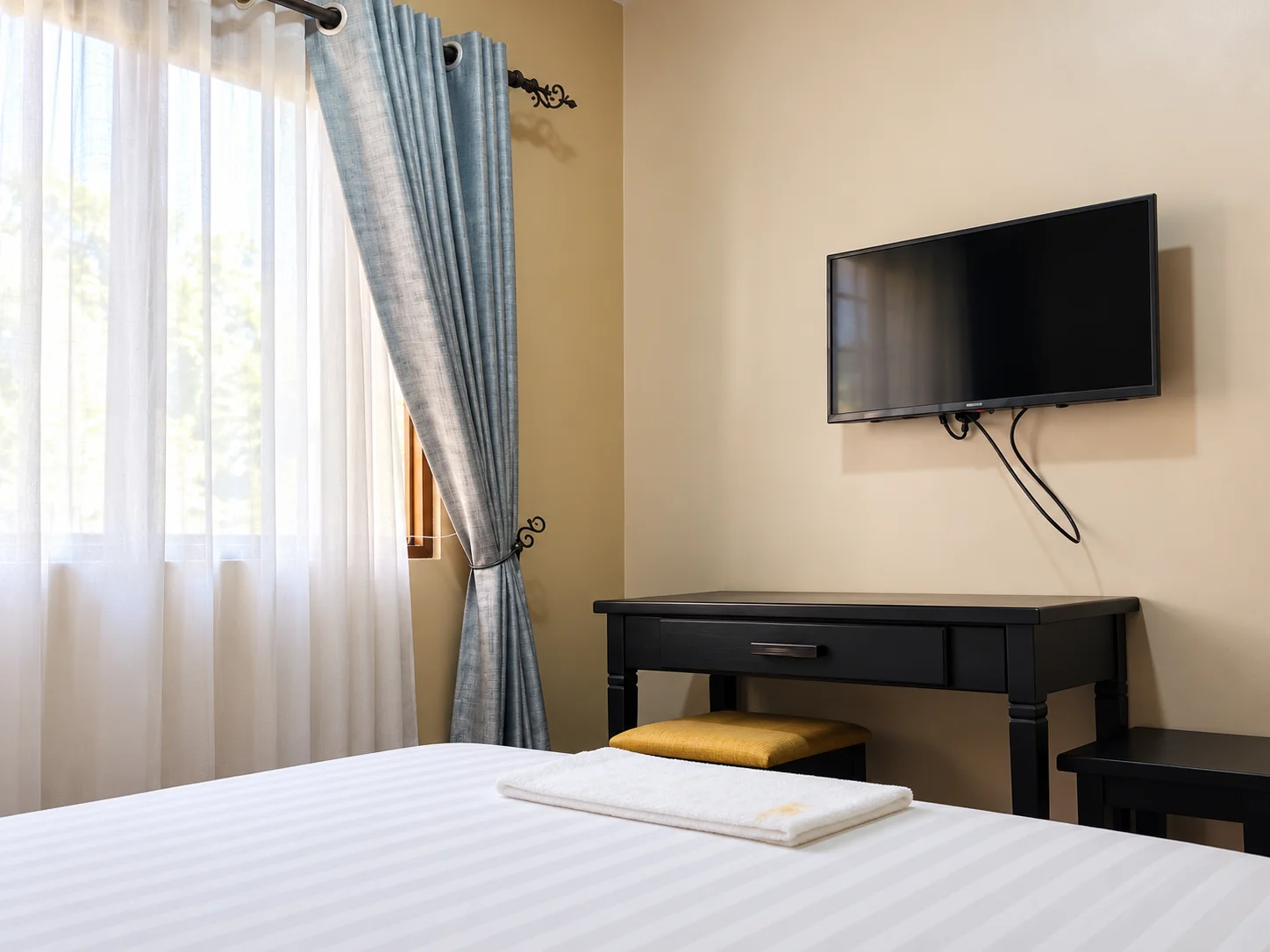Writing desk and television in the double room